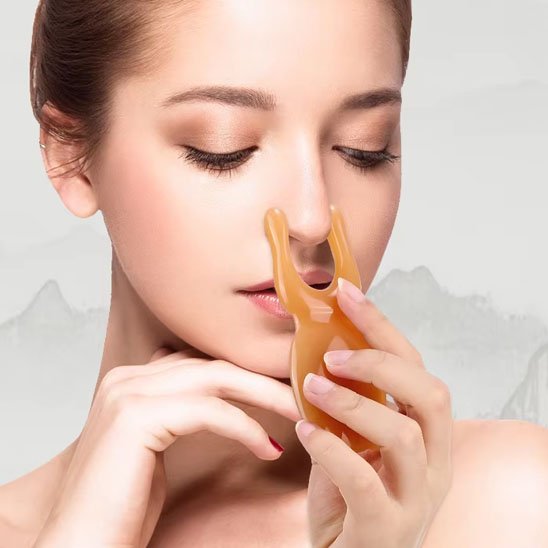 Gua sha visage pour masser la mâchoire et les joue